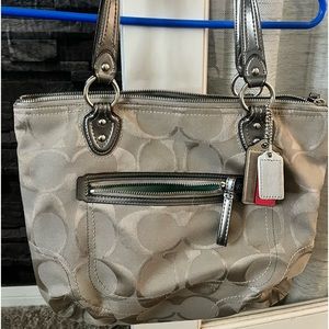 Authentic coach purse. Light grey on the outside and light teal on the inside.